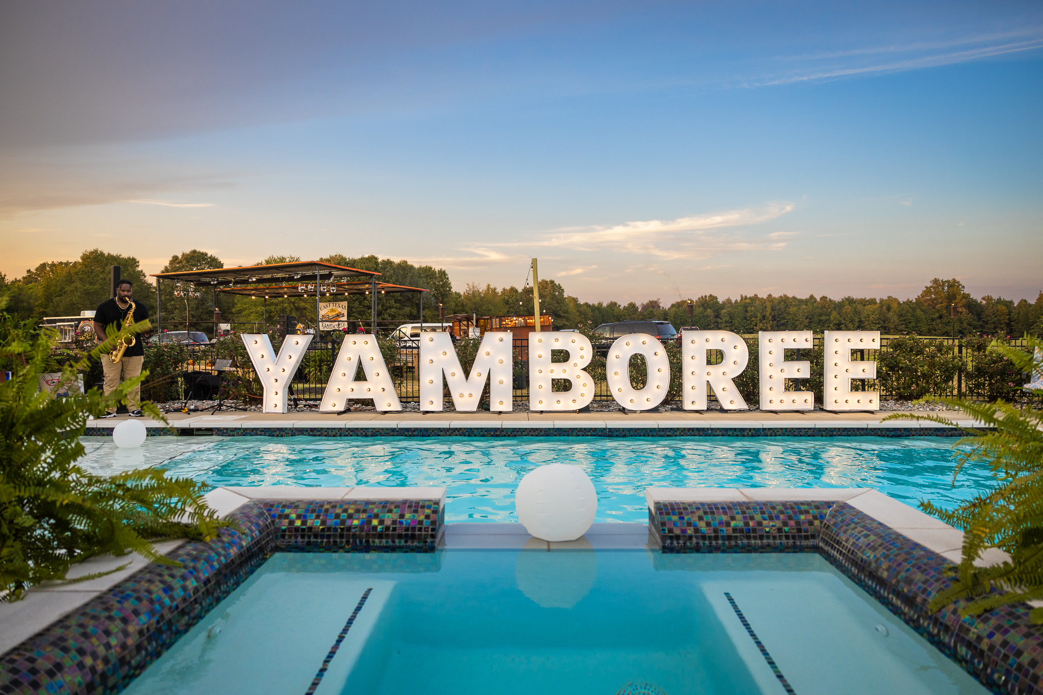 A pool with a sign that says yamboree.