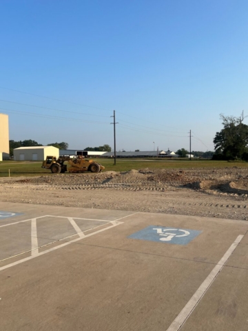 Construction site with a handicapped parking spot.