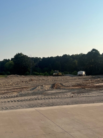 Construction site with bulldozer and truck.