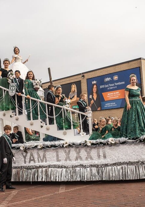 A Yamboree Queen's Parade float with a group of people on it.